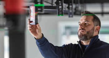 The Leica RGR300-D digital receiver for line lasers on a tripod, showing how it integrates with other construction tools